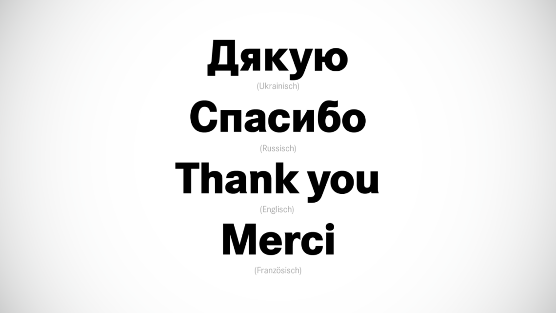 In schwarz steht das Wort "Danke" auf Ukrainisch, Russisch, Englisch und Französisch auf weißem Hintergrund