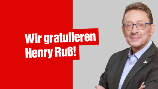 Foto von Henry Ruß, links daneben der Text "Wir gratulieren Henry Ruß!"